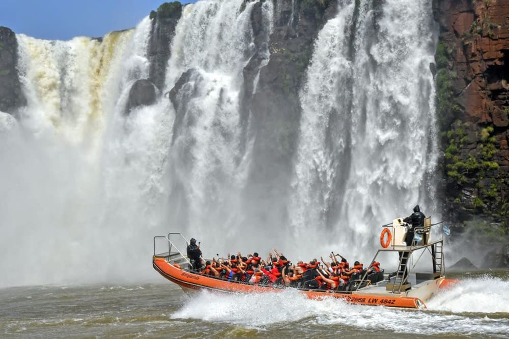 Boat under the Iguazú Falls